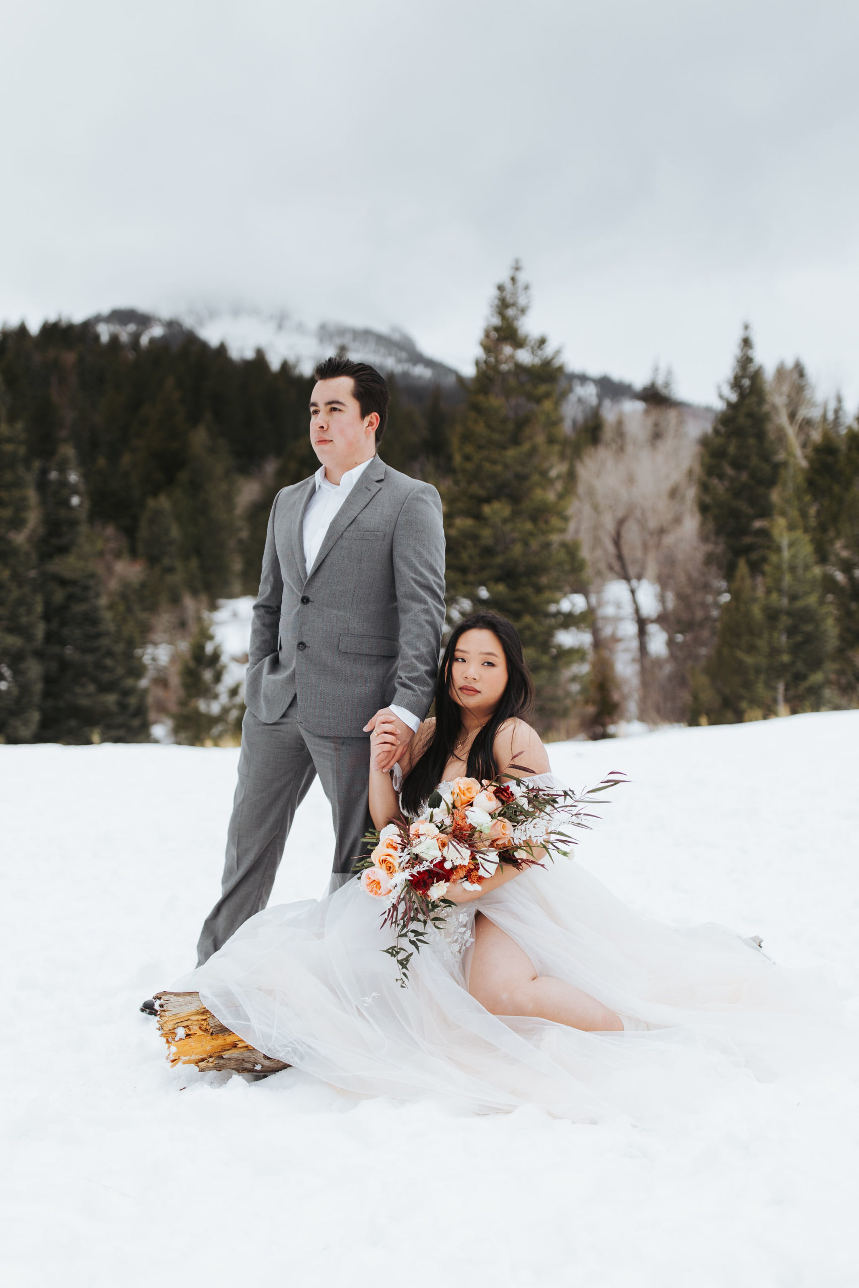 bride and groom on a snowy mountain in utah