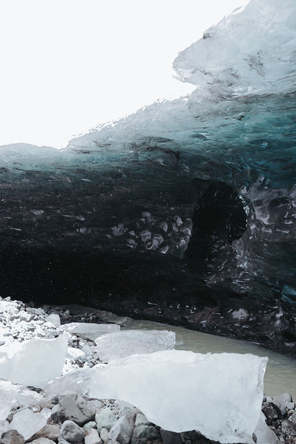 ice cave and dark blue frozen lagoon