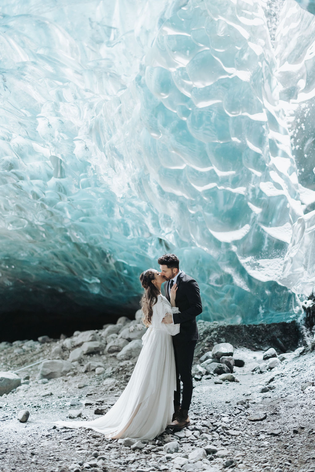 wedding portraits in ice cave with sky