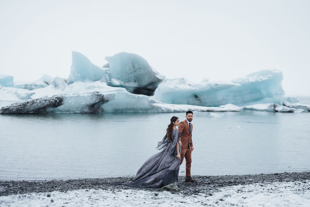 couple portraits by frozen lagoon