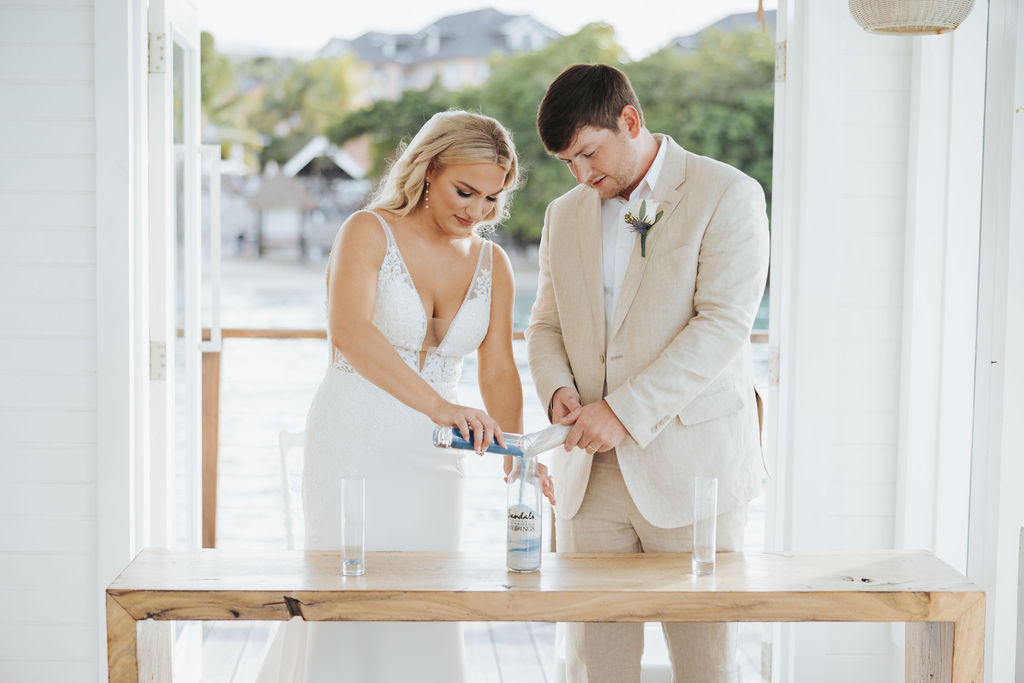 bride and groom mixing sand at wedding