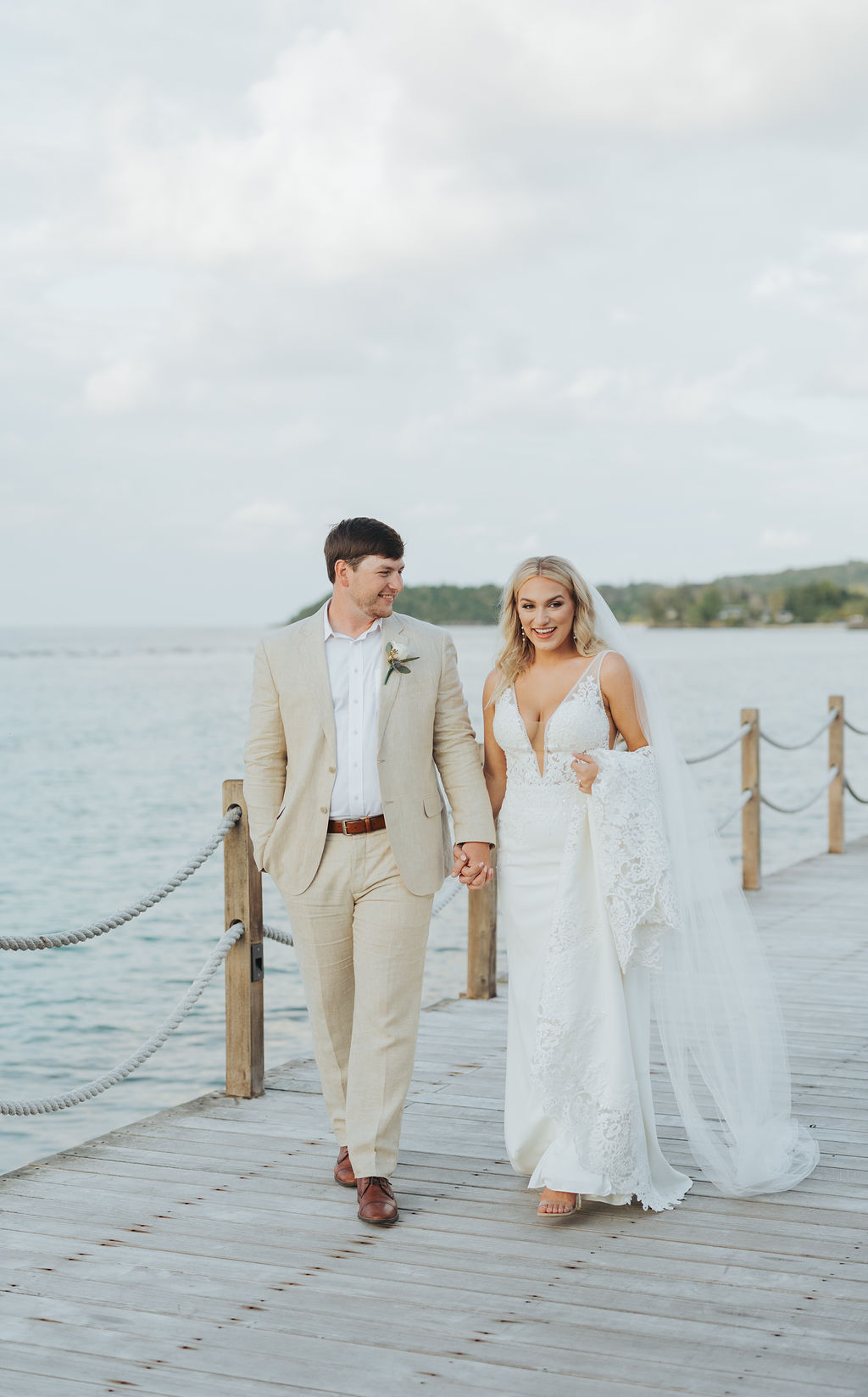 bride and groom golden hour portraits on the water in jamaica