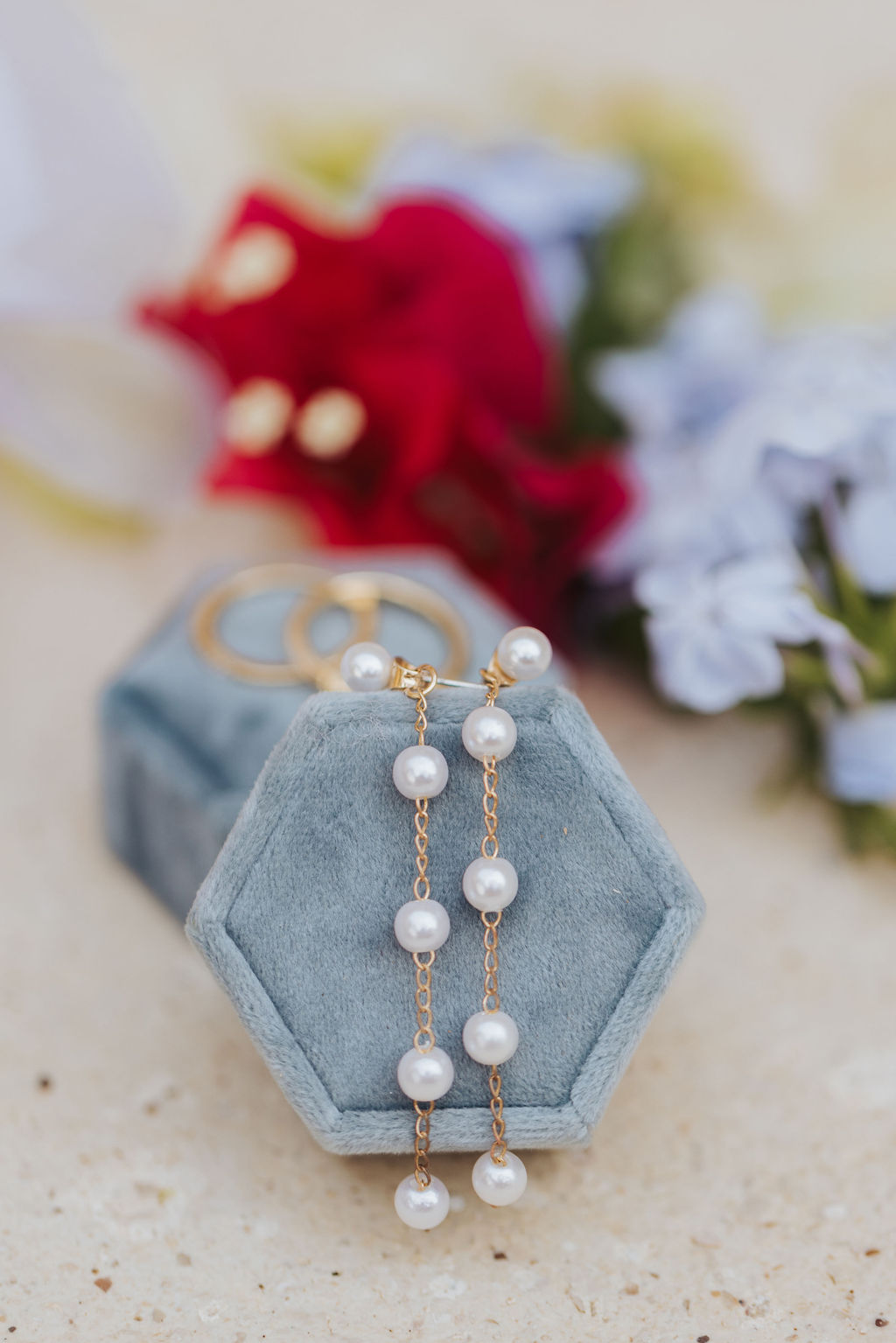 wedding earrings in a blue velvet box