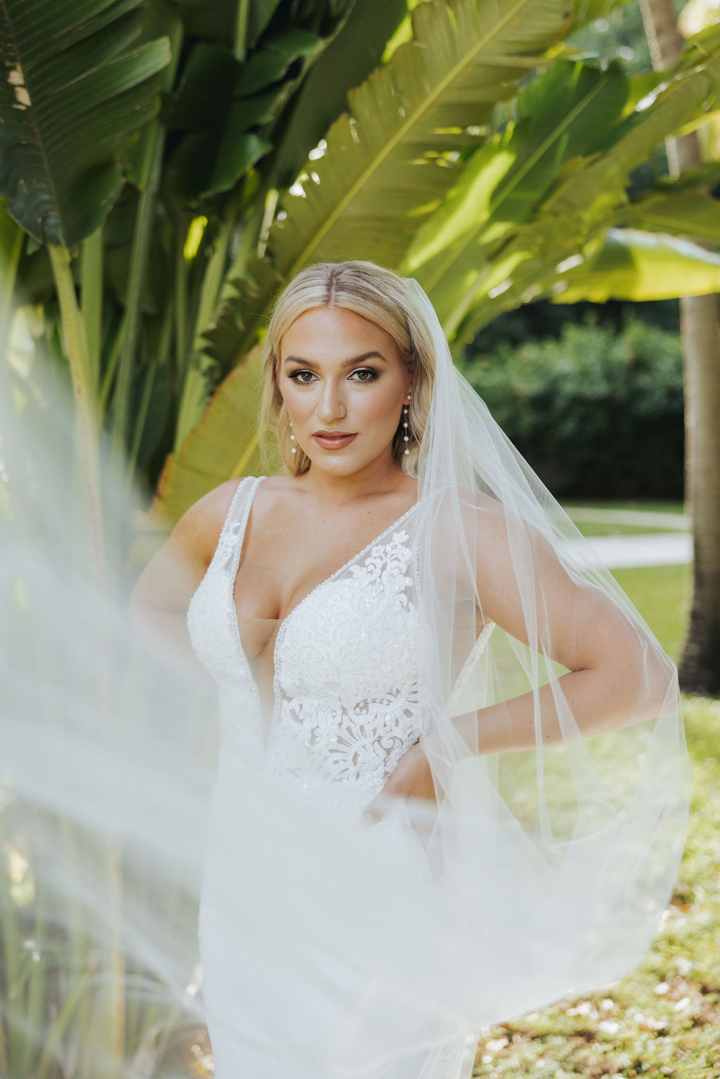 bridal portrait in front of palm tree