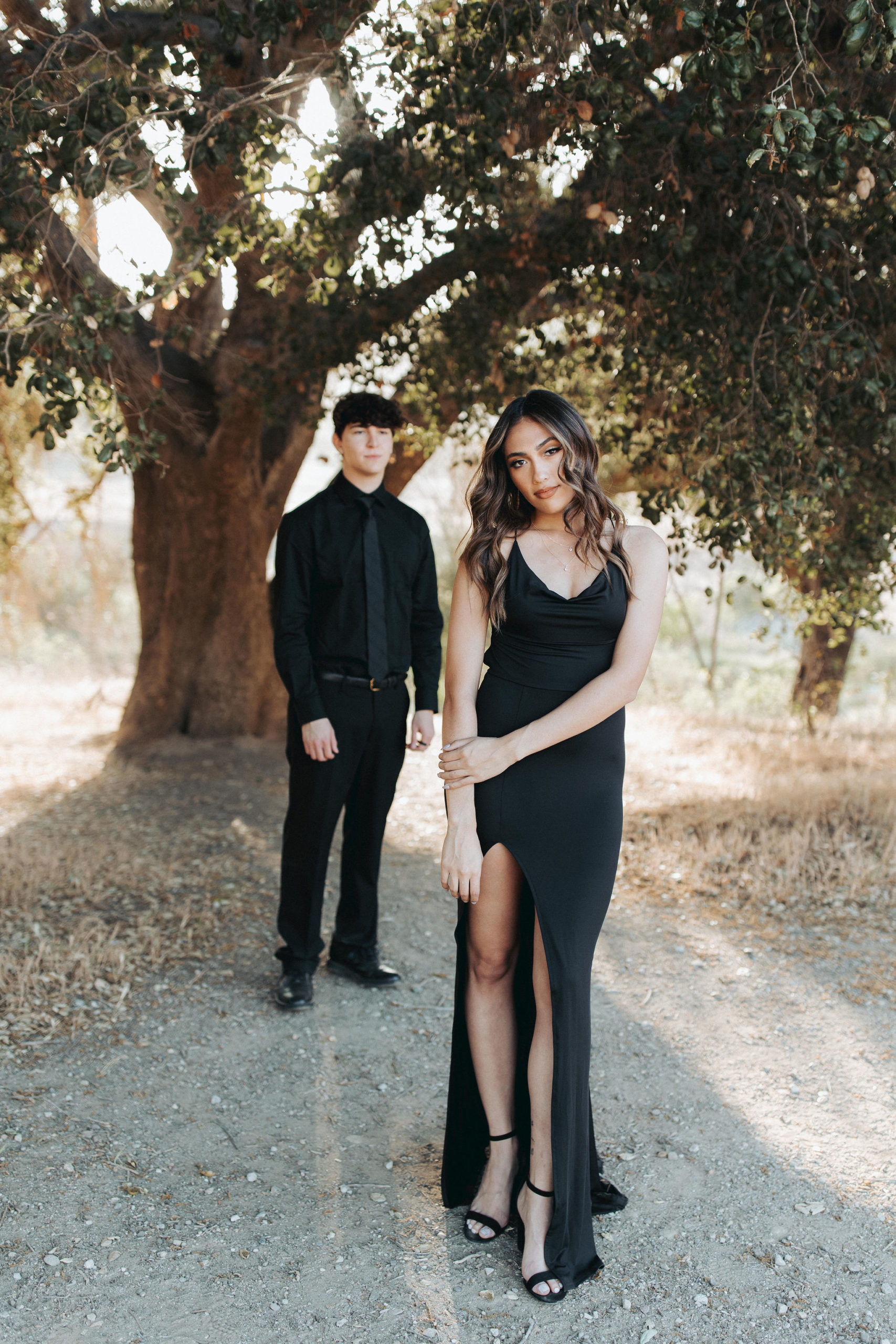 couple posing in front of tree in Malibu Creek State Park