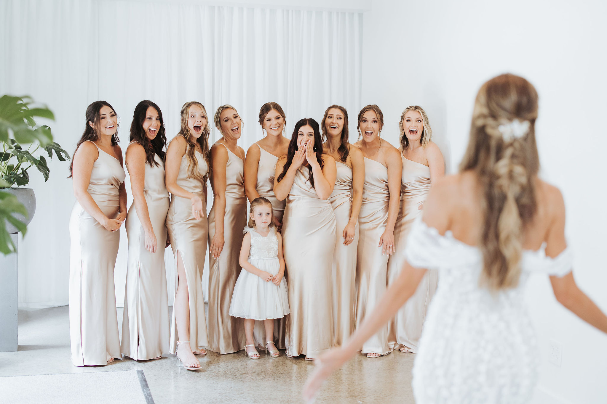 bride first look with bridesmaids