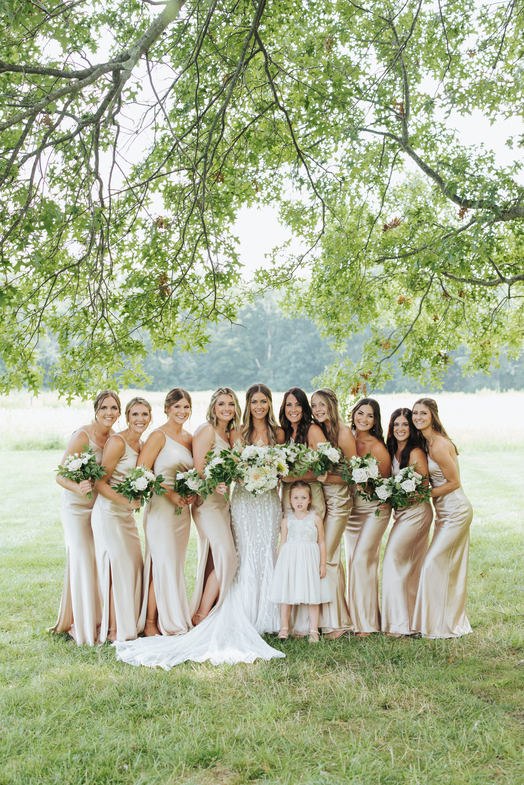 bride with bridesmaids in pink satin dresses