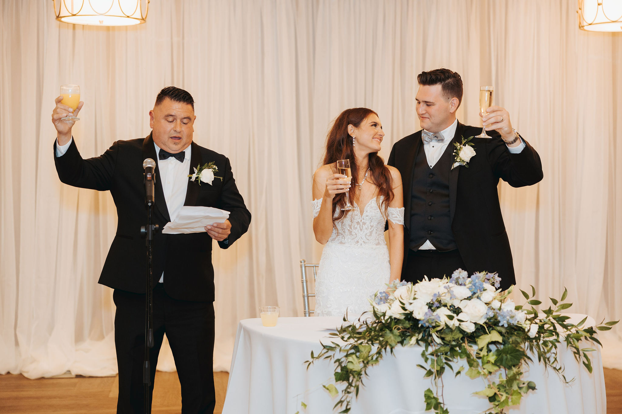 bride and groom toast at reception