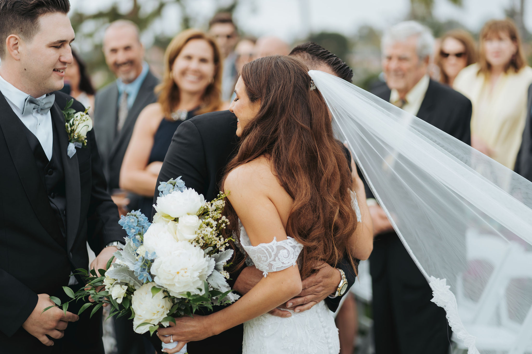 bride walking down the aisle with her dad