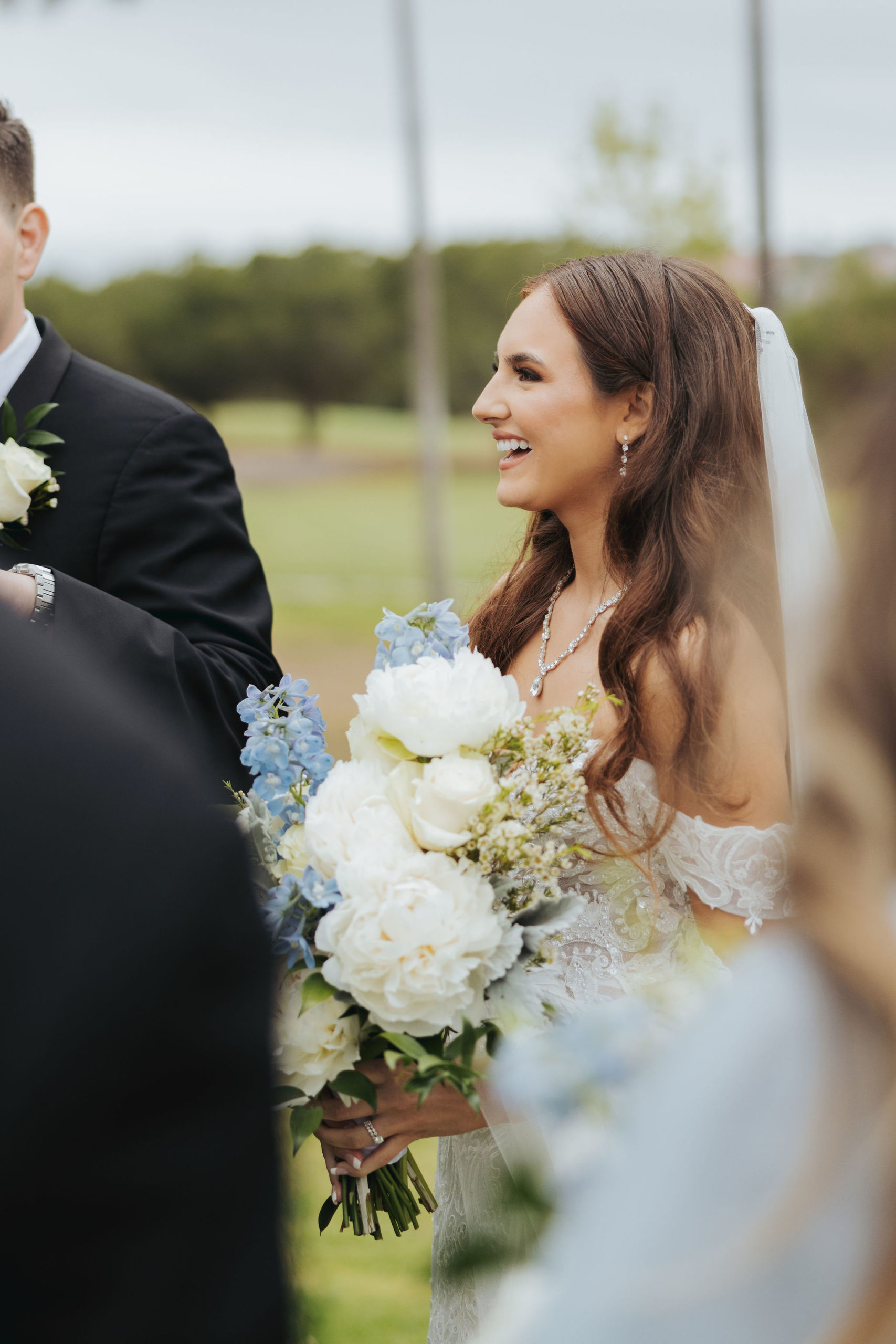 bride holding bouquet after wedding ceremony