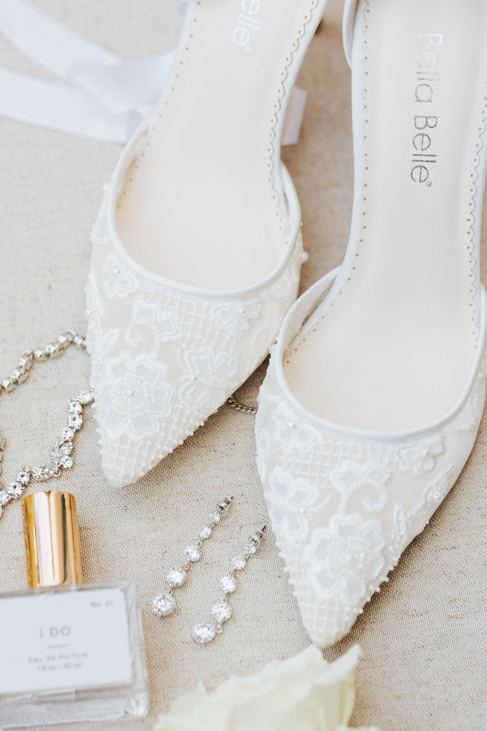 bride perfume with garter, shoes and jewelry