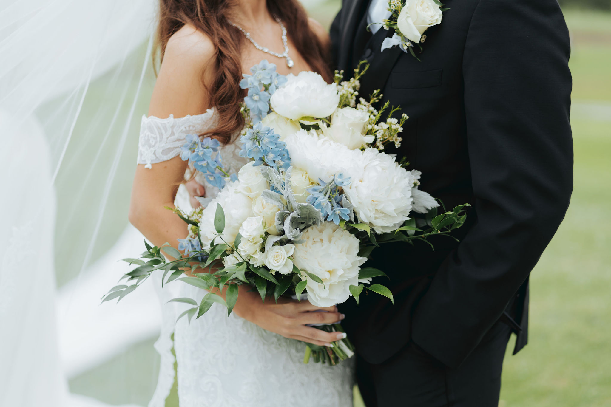 bride and groom just married portraits with blue and white bouquet