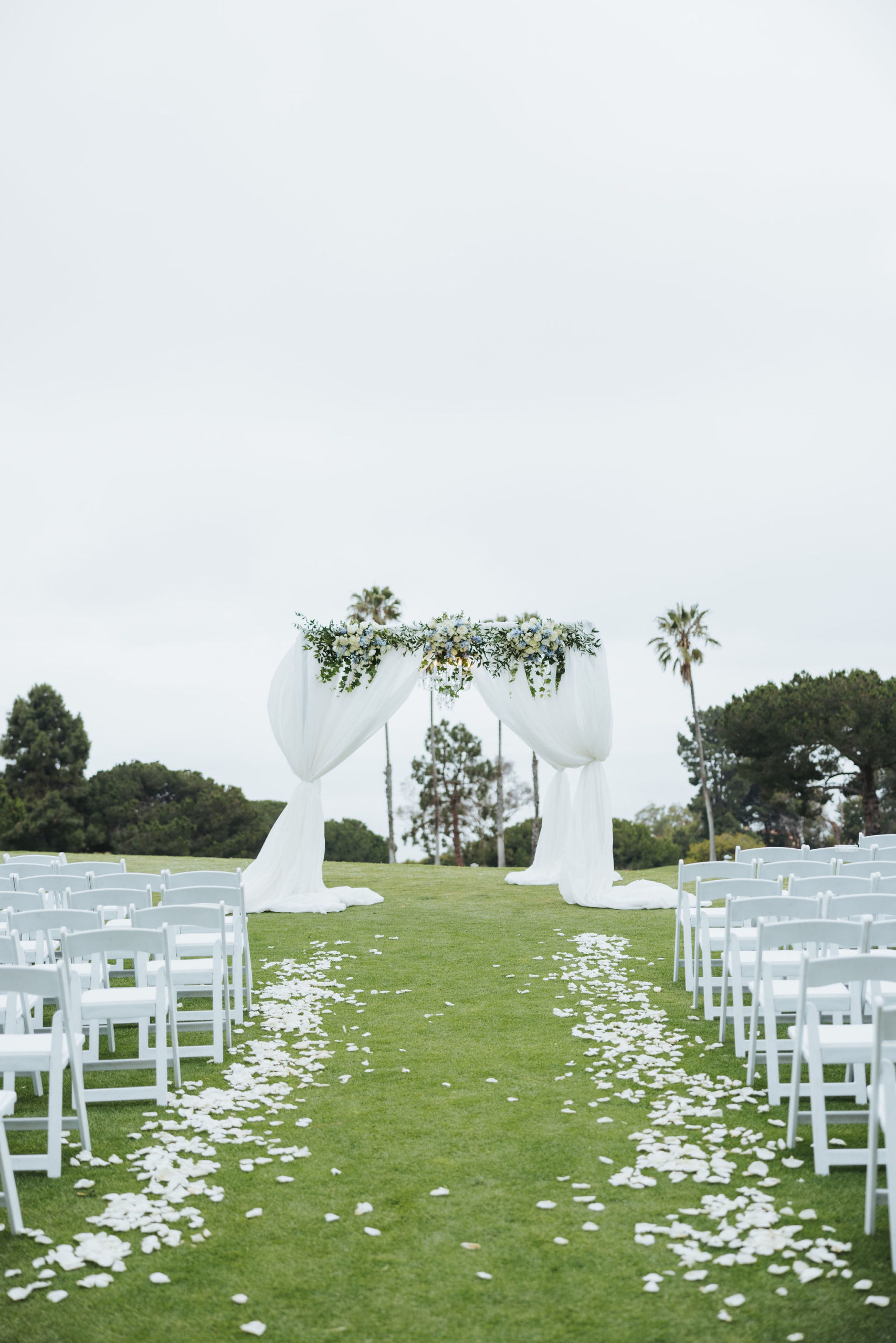 wedding ceremony at golf course with floral arch