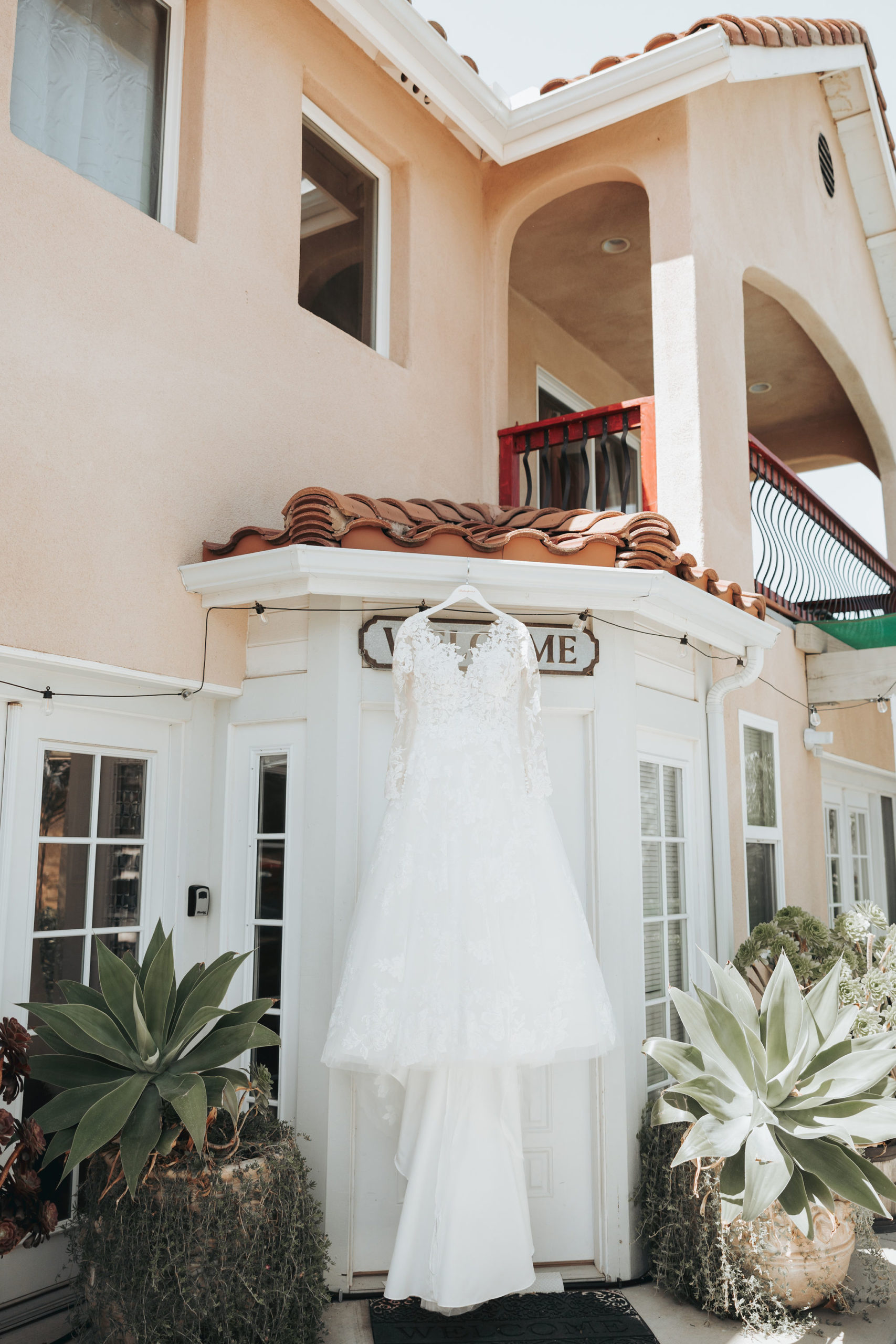 wedding dress hanging on villa roof