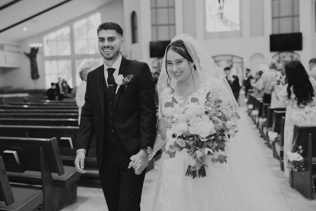 bride and groom exiting church after wedding ceremony in temecula california