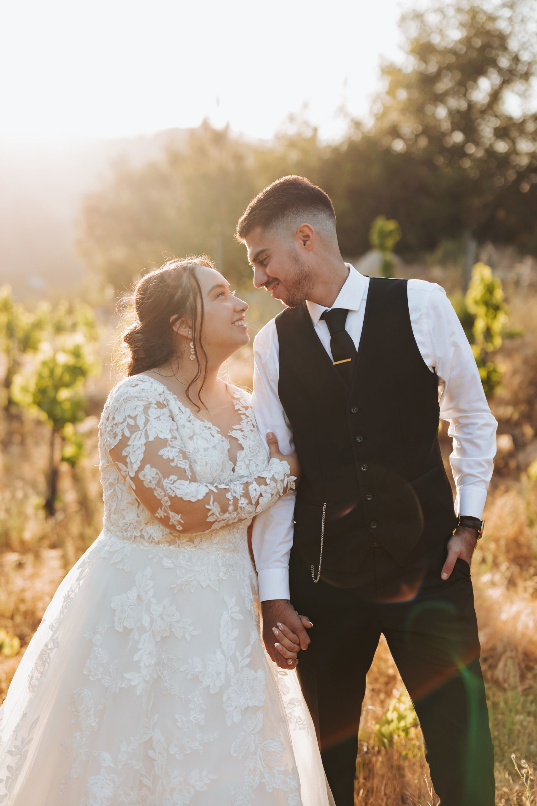 bride and groom hugging in Temecula california vineyard