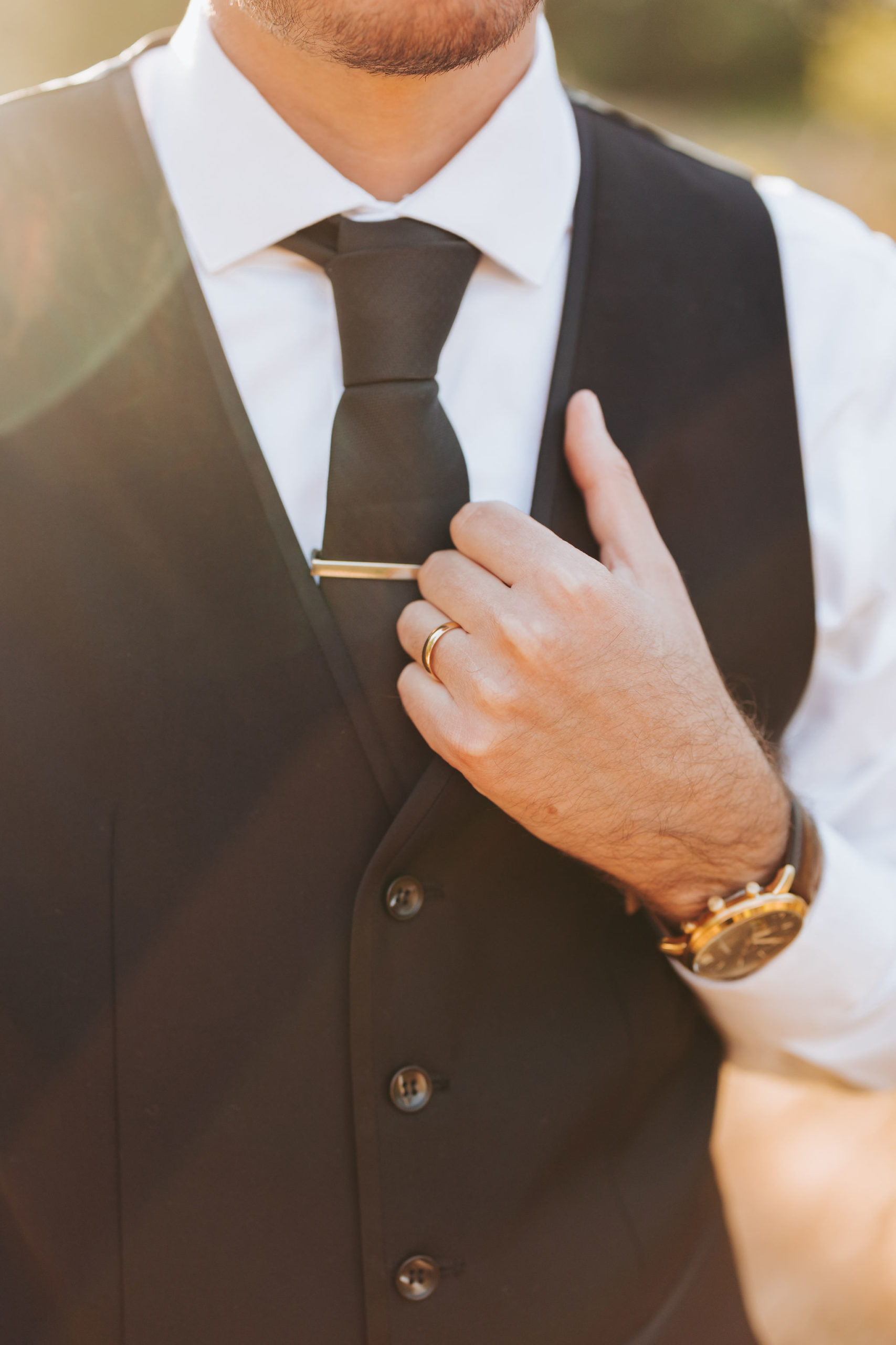 groom black vest and tie detail