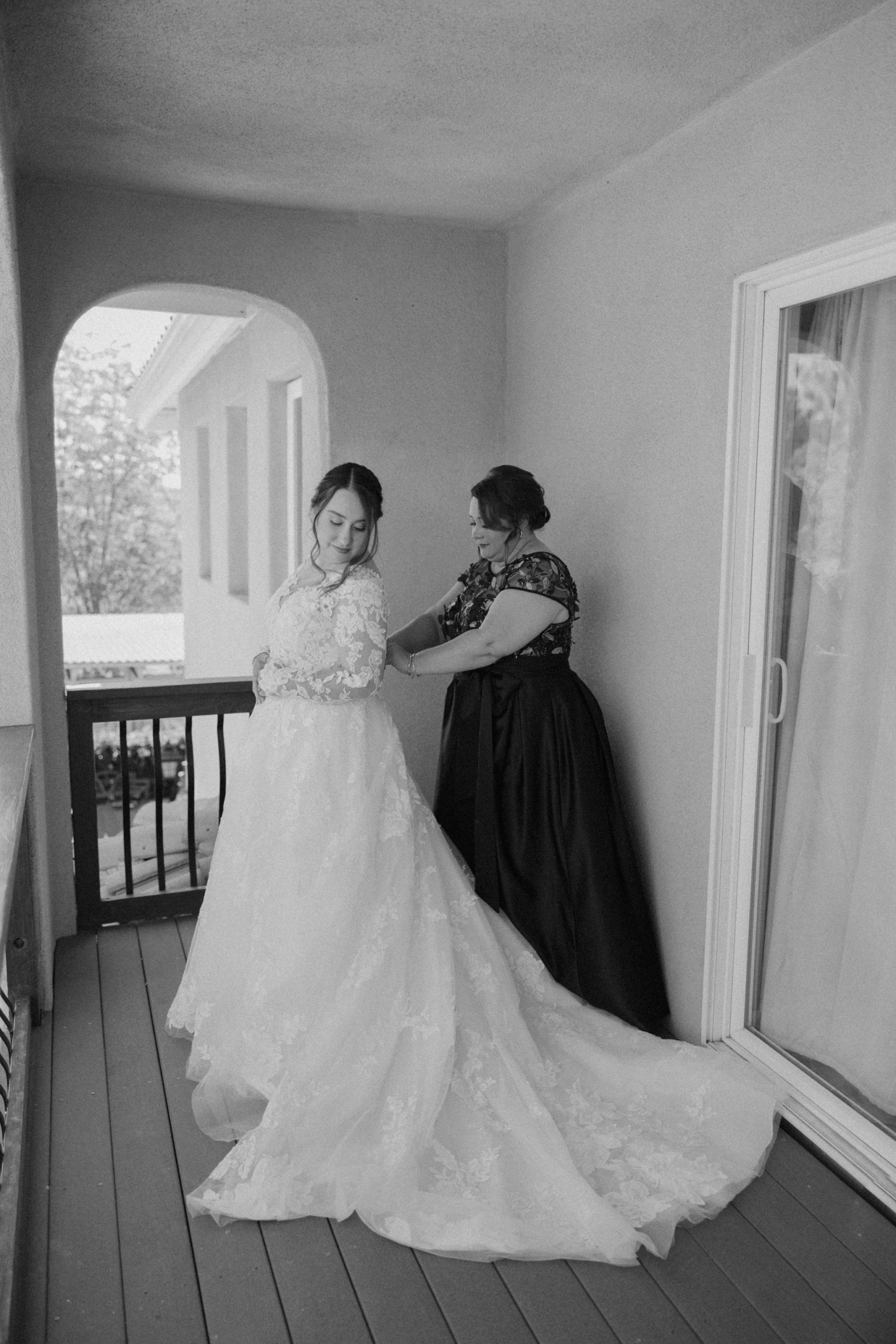 bride getting ready with her mother