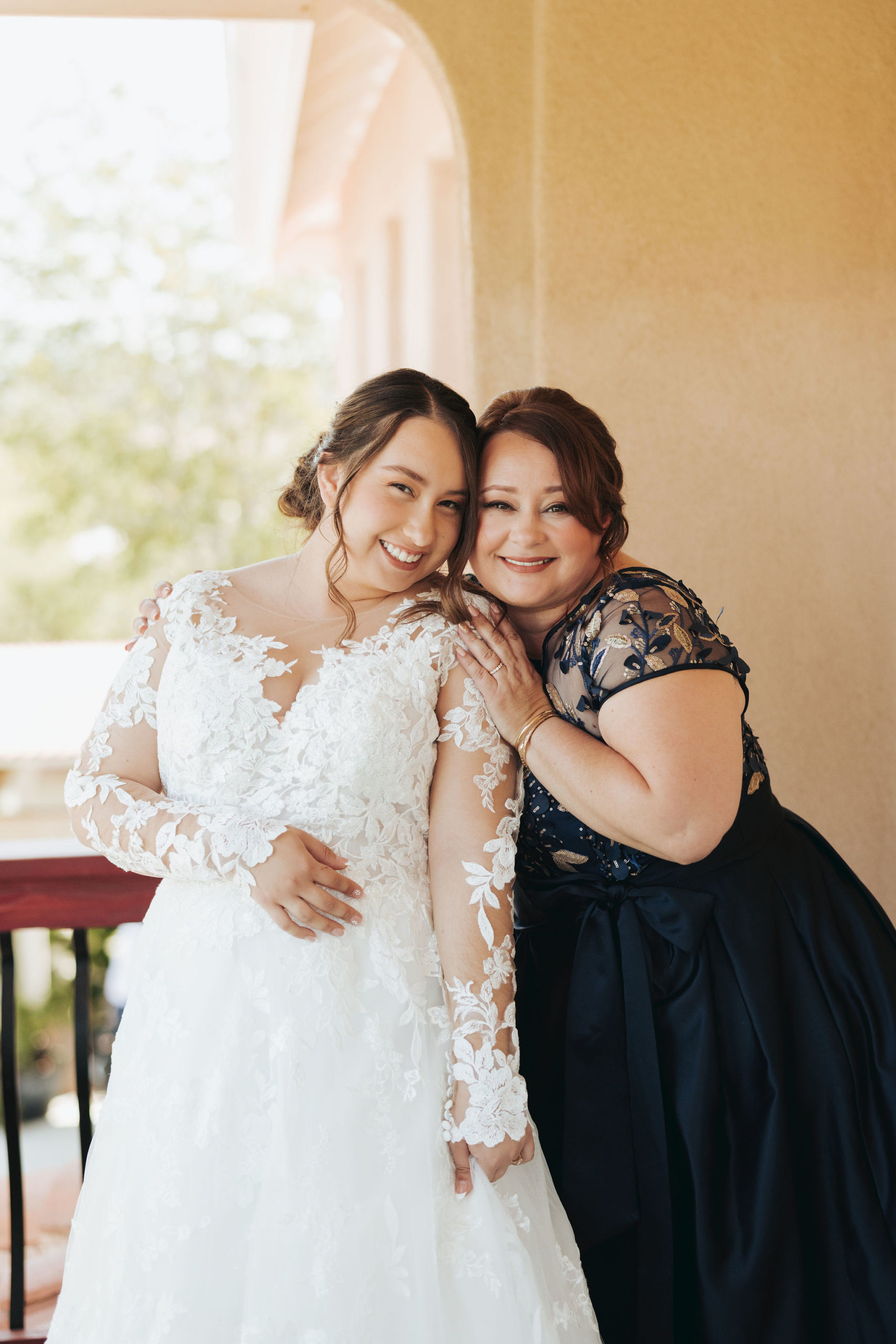 bride posing with her mother