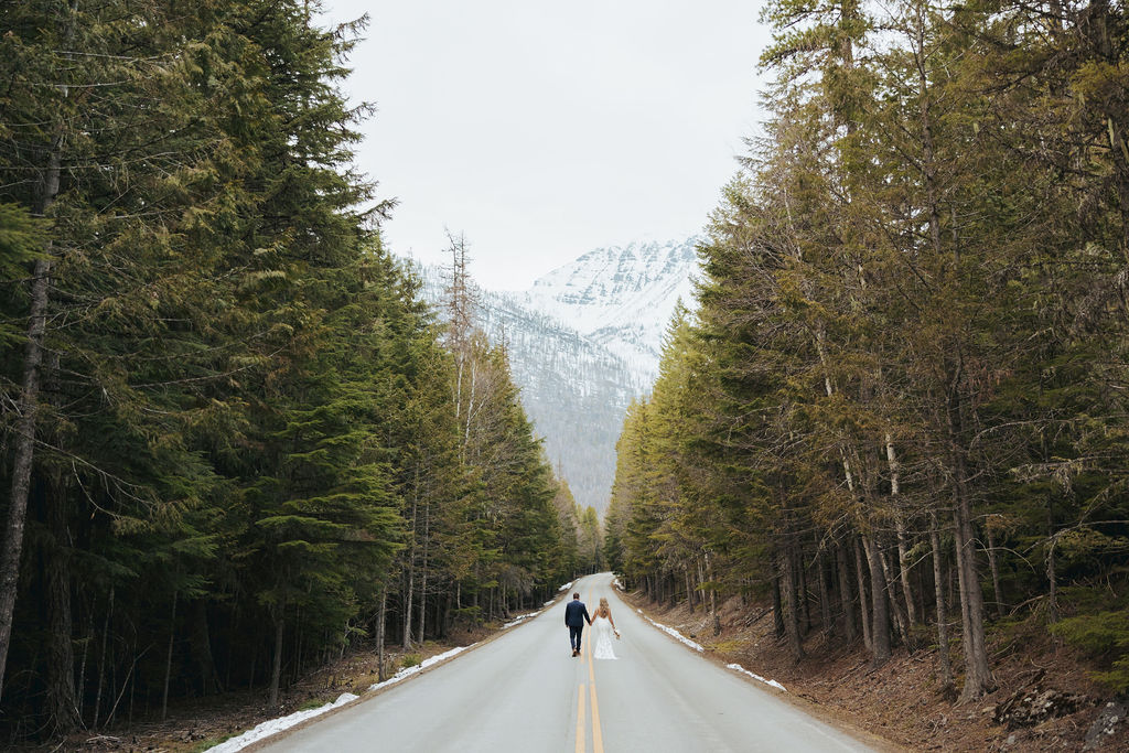 bride and groom portraits at glacier national park in front of mountains