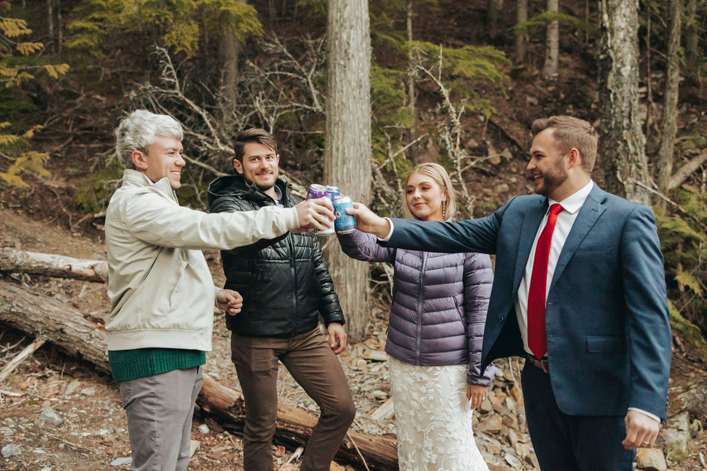 bride and groom toasting at glacier national park