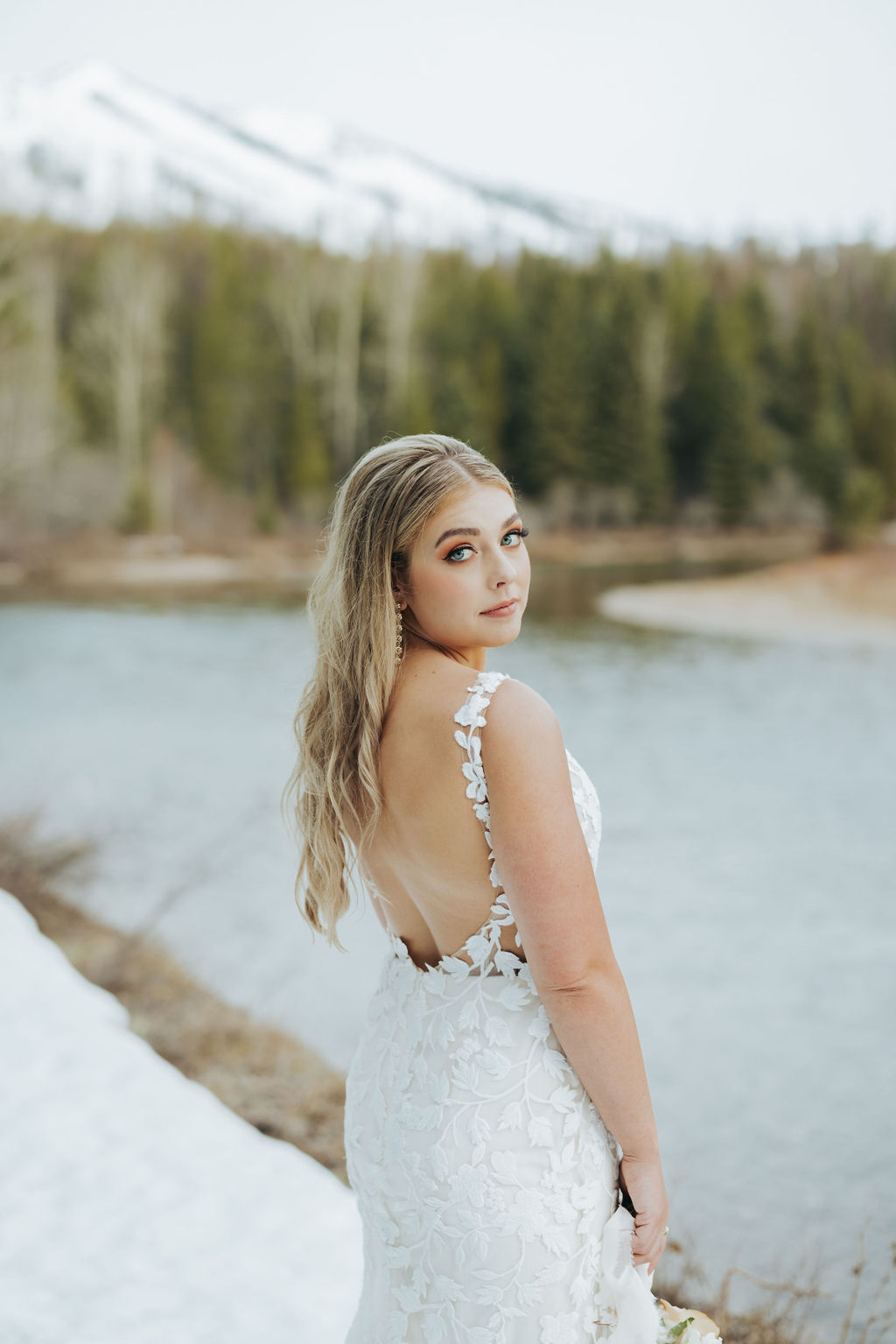 bride portraits at glacier national park in front of trees