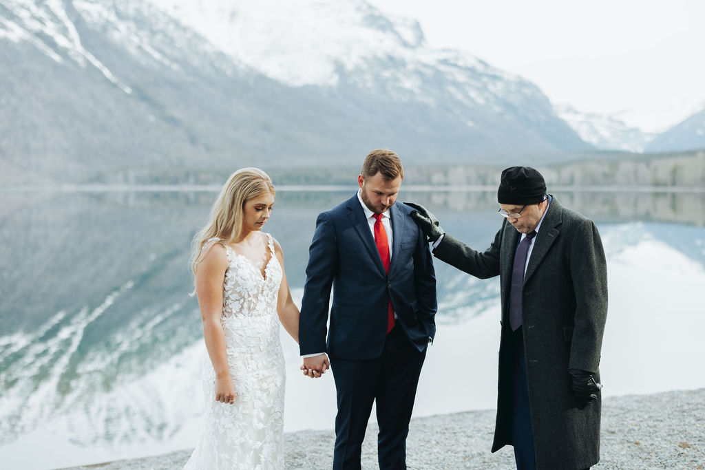 glacier national park elopement ceremony with bride and groom