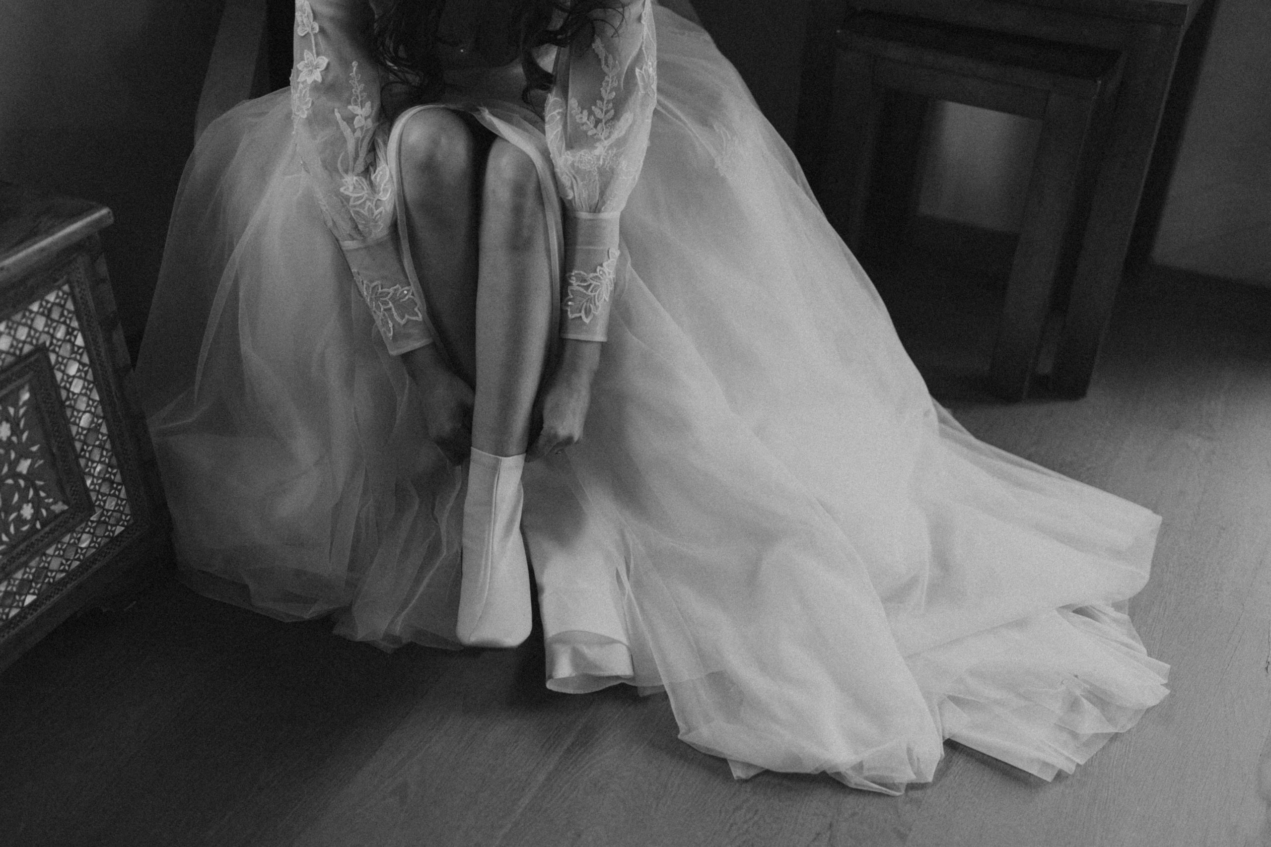 bride putting on white boots