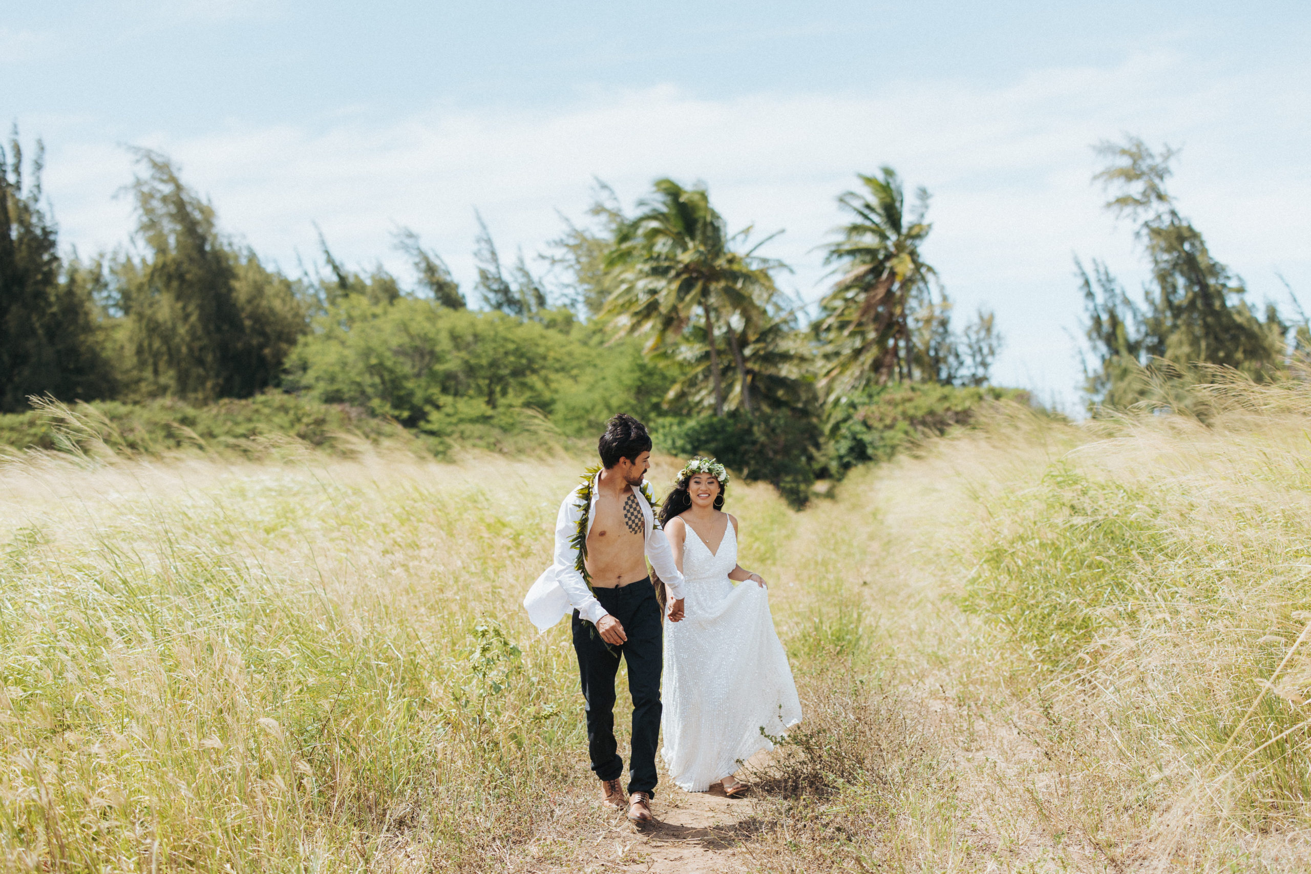 bride and groom walking couple portrait in hawaii