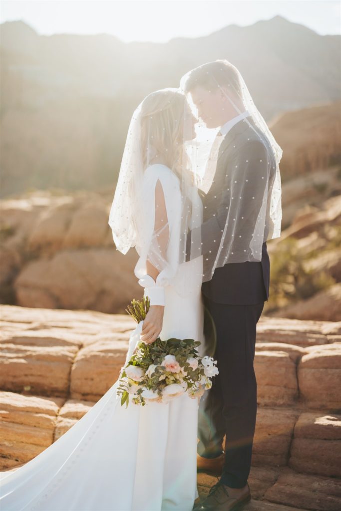 bride and groom canyon elopement portraits kissing