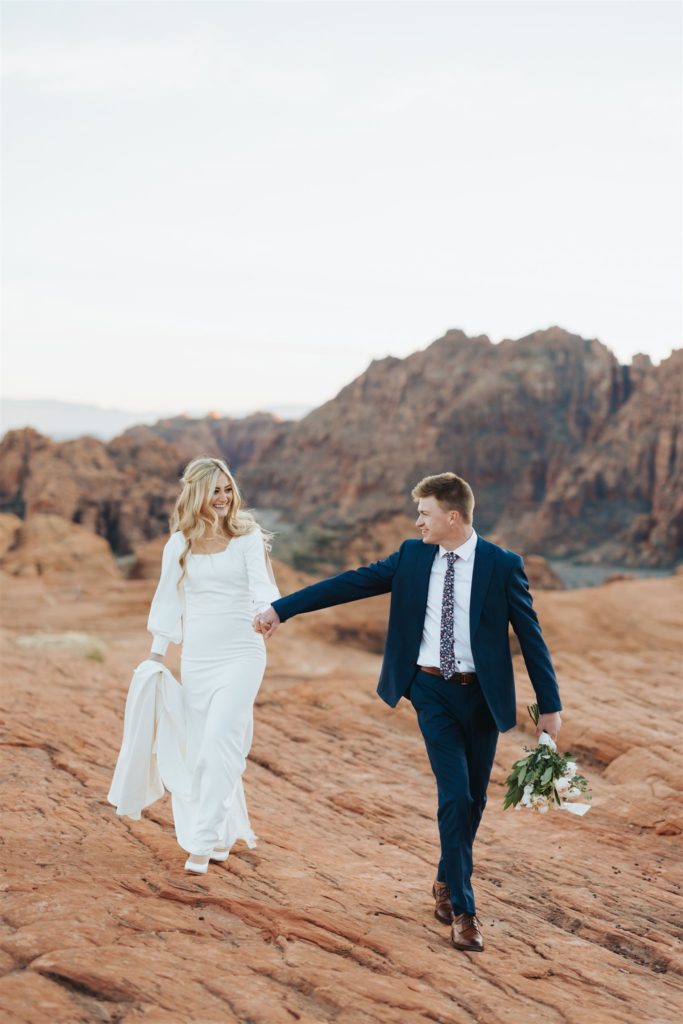 bride and groom canyon elopement portraits walking