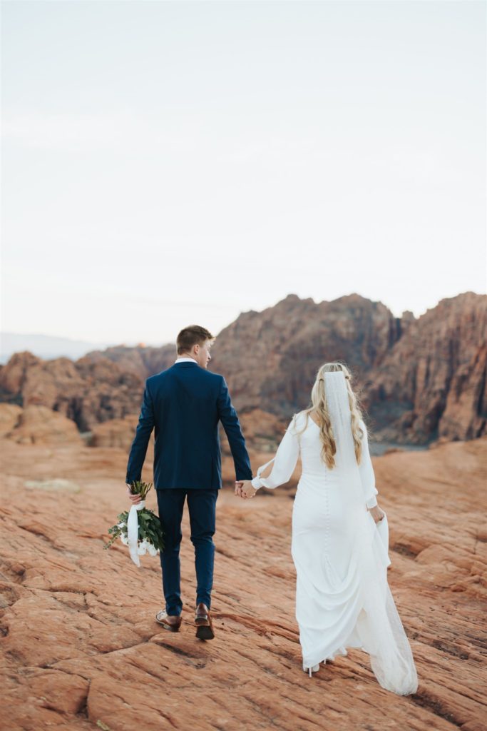 bride and groom canyon elopement portraits walking