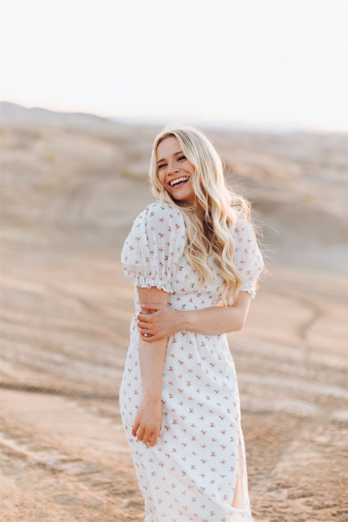 woman in puff sleeve dress engagement session