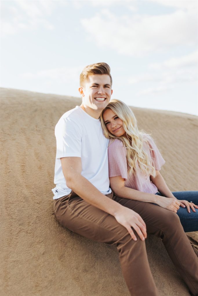 Couple hugging on the sand dune