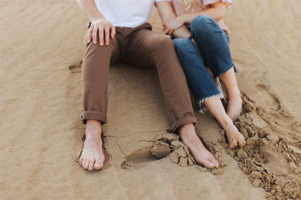 Couple hugging on the sand dune