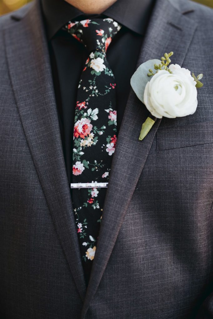 groom gray suit with floral tie