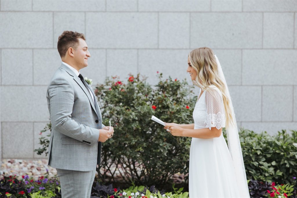 bride and groom exchanging vows at temple wedding sealing  at Draper Temple in Utah