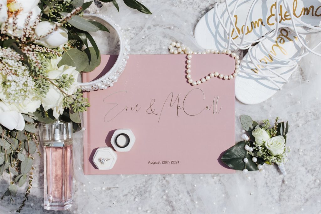 Pink wedding stationary invitation with wedding details at Draper Temple in Utah