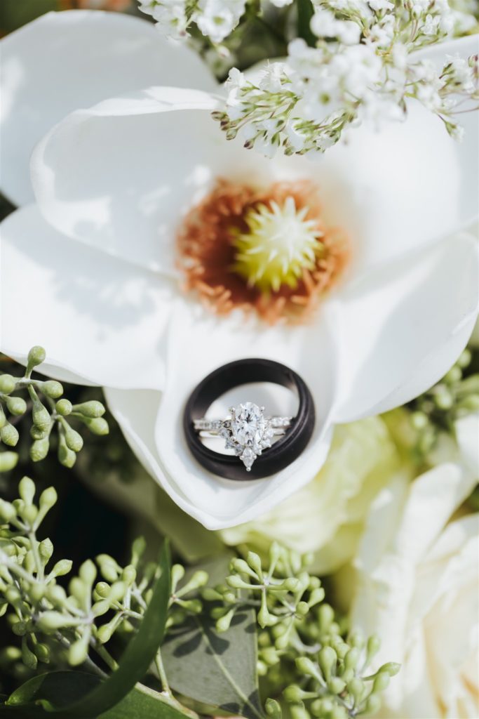 wedding rings in a flower detail at Le Jardin wedding venue in Draper Utah