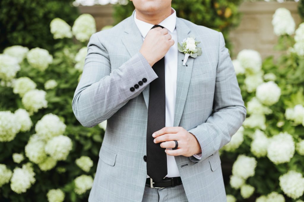groom gray wedding suit with black tie at Le Jardin wedding venue in Draper Utah