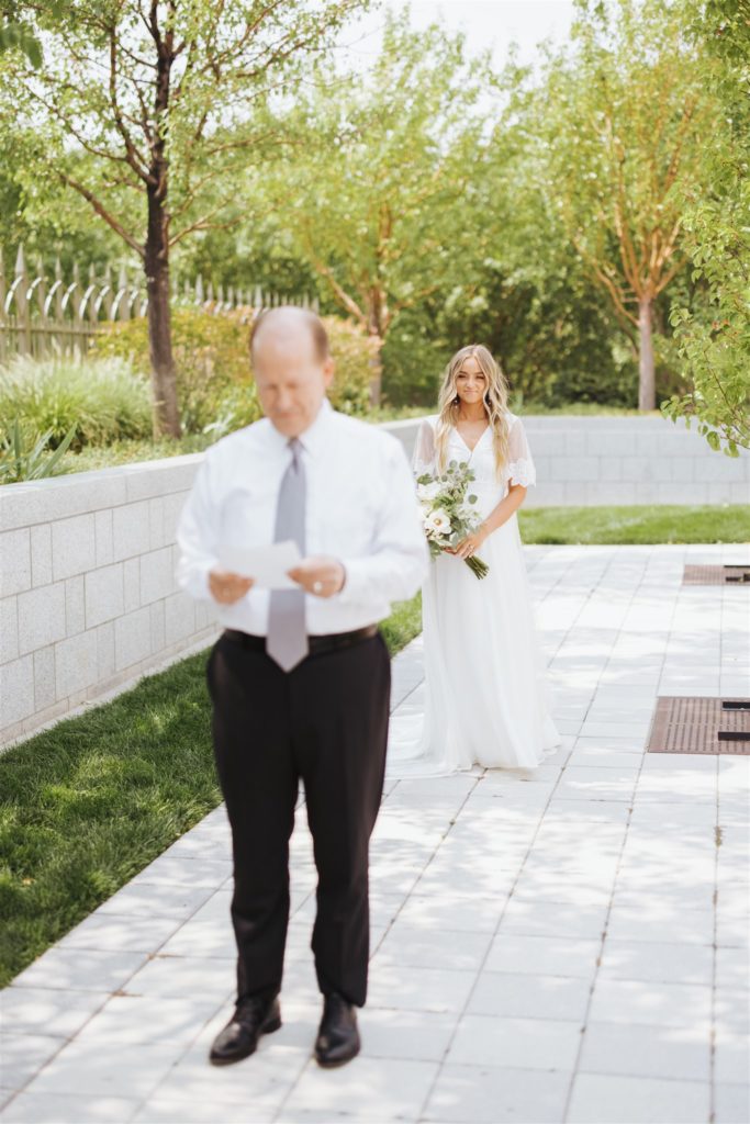 bride first look with father at Draper Temple in Utah