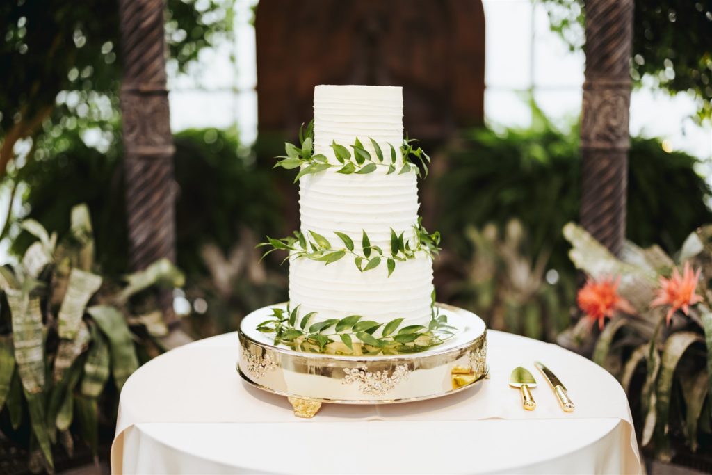 white wedding cake with eucalyptus leaves at Le Jardin wedding venue in Draper Utah