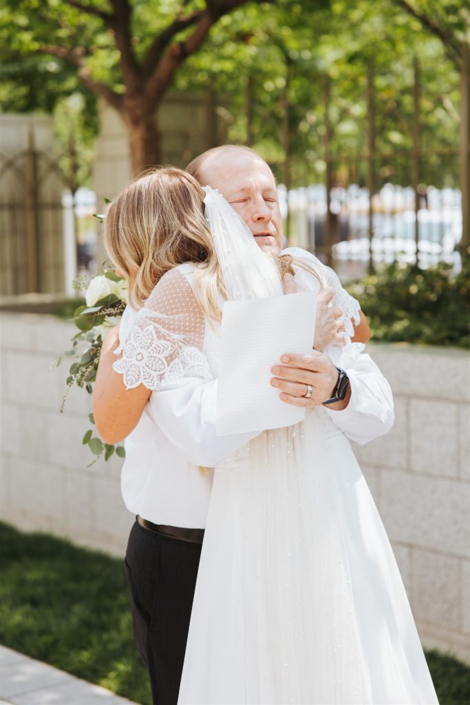 emotional bride first look with father  at Draper Temple in Utah