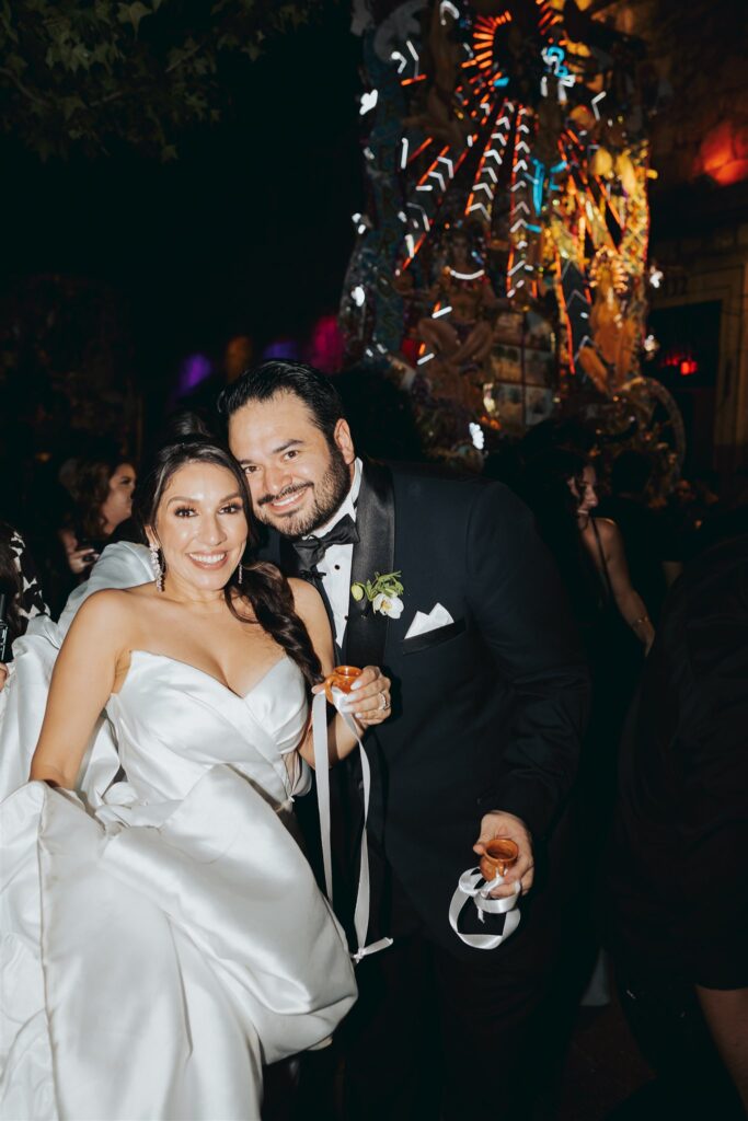 bride and groom with drinks at wedding reception in morelia mexico
