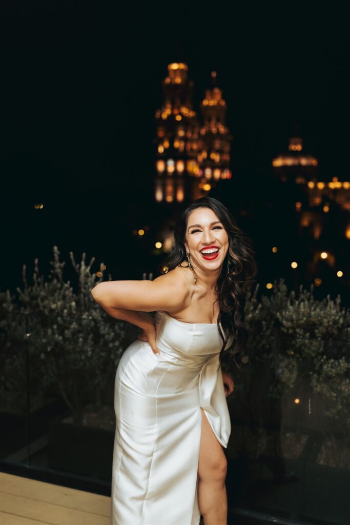 bride laughing at wedding reception