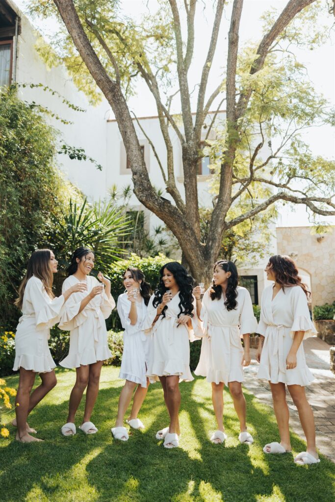 bride and bridesmaids getting ready in robes and slippers in morelia mexico