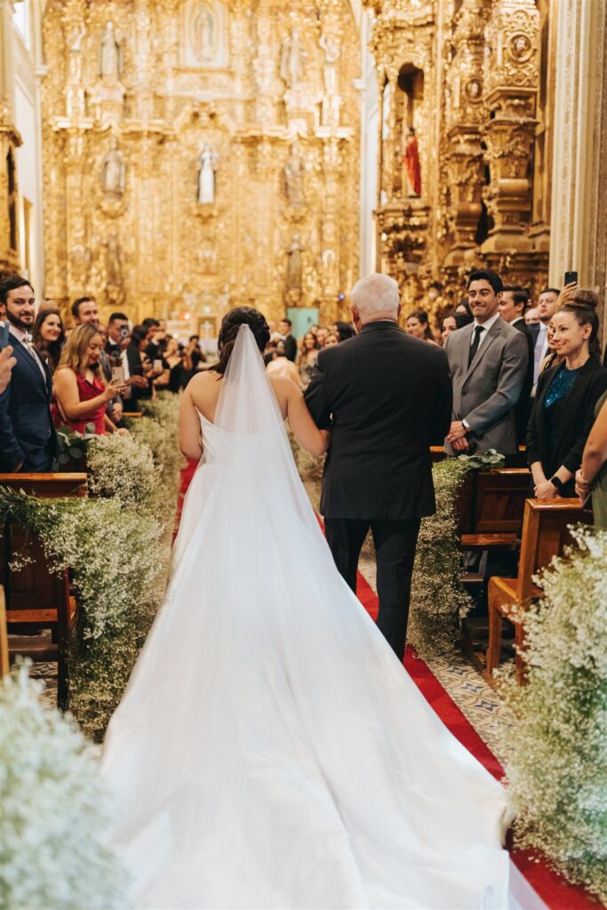 bride walking down the aisle in cathedral in Morelia Mexico