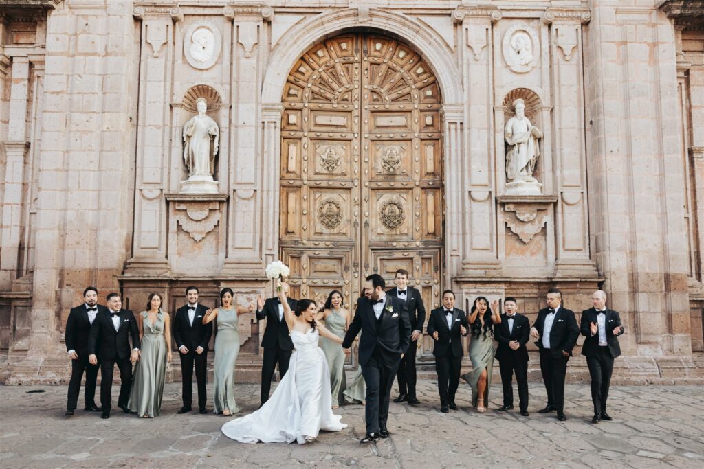 bride and groom family portraits in front of cathedral in morelia mexico
