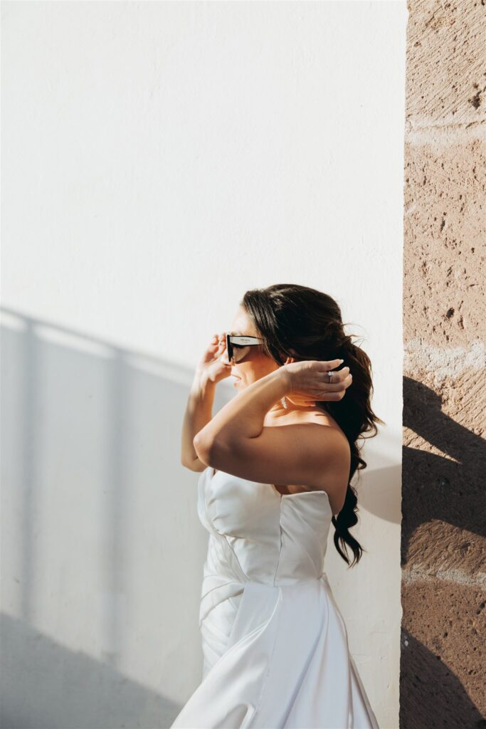bride with ponytail and sunglasses