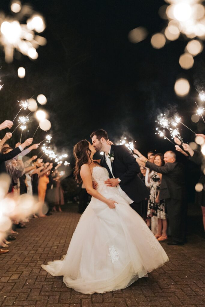 bride and groom kissing with sparklers birmingham alabama
